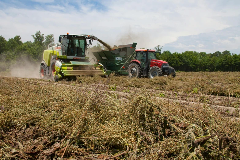 there are two different tractors in a field