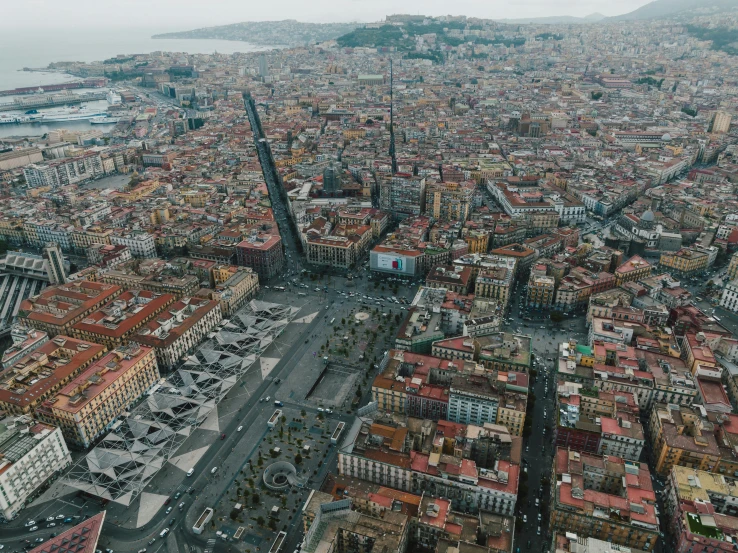 aerial po of a large city with a river and buildings