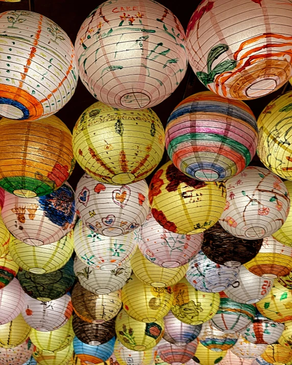 lanterns hanging from the ceiling in a store