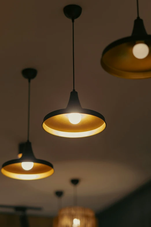 three lights and four round hanging lights