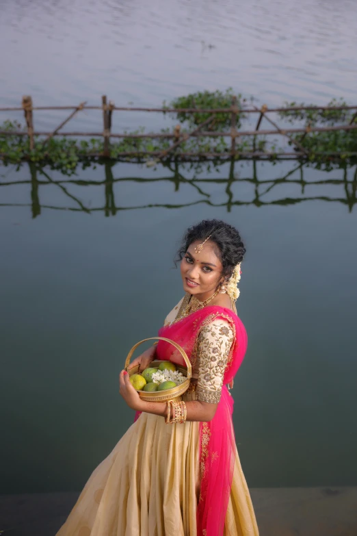 the woman in the yellow dress is holding her basket