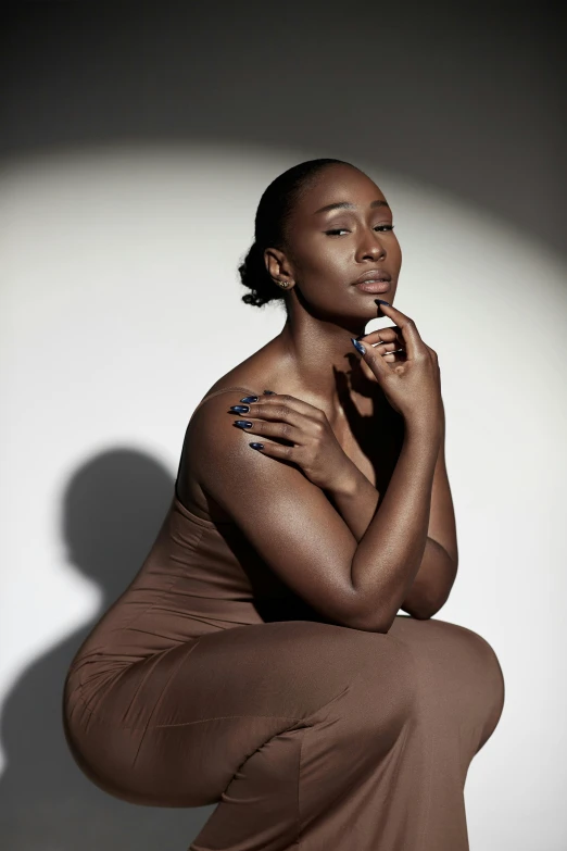 black woman with a finger tattoo sitting down