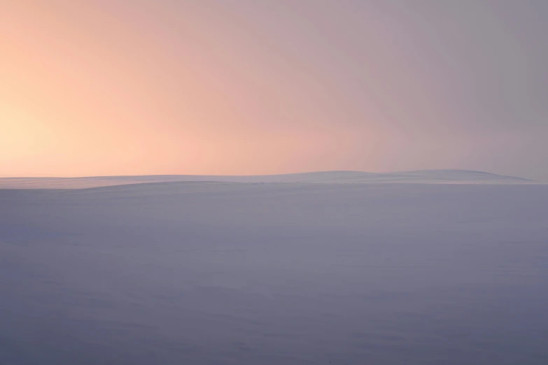 the view of a hilly area covered in snow