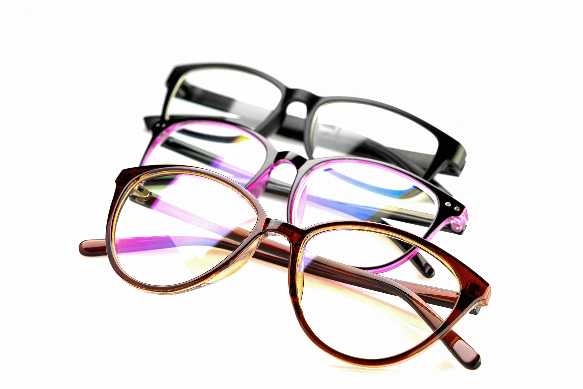 three pair of eyeglasses on white surface