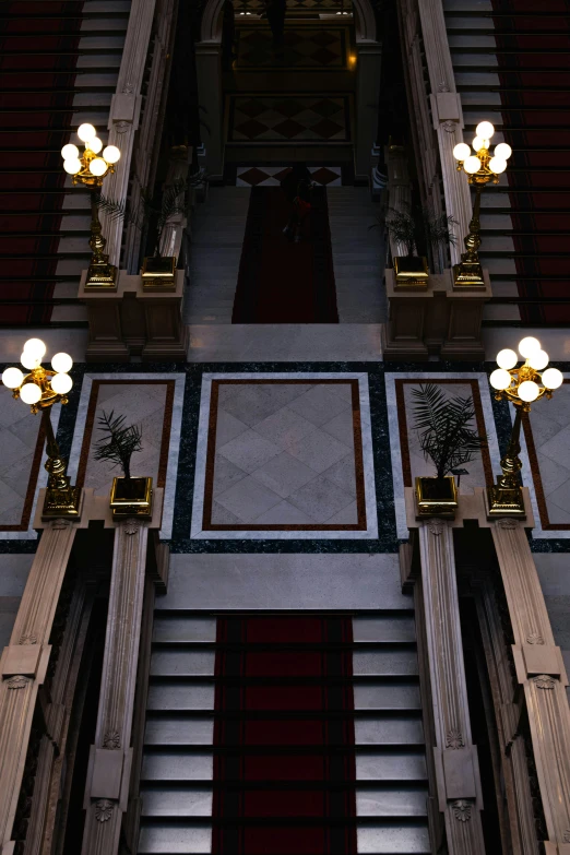 an inside view of the staircase with several lamps