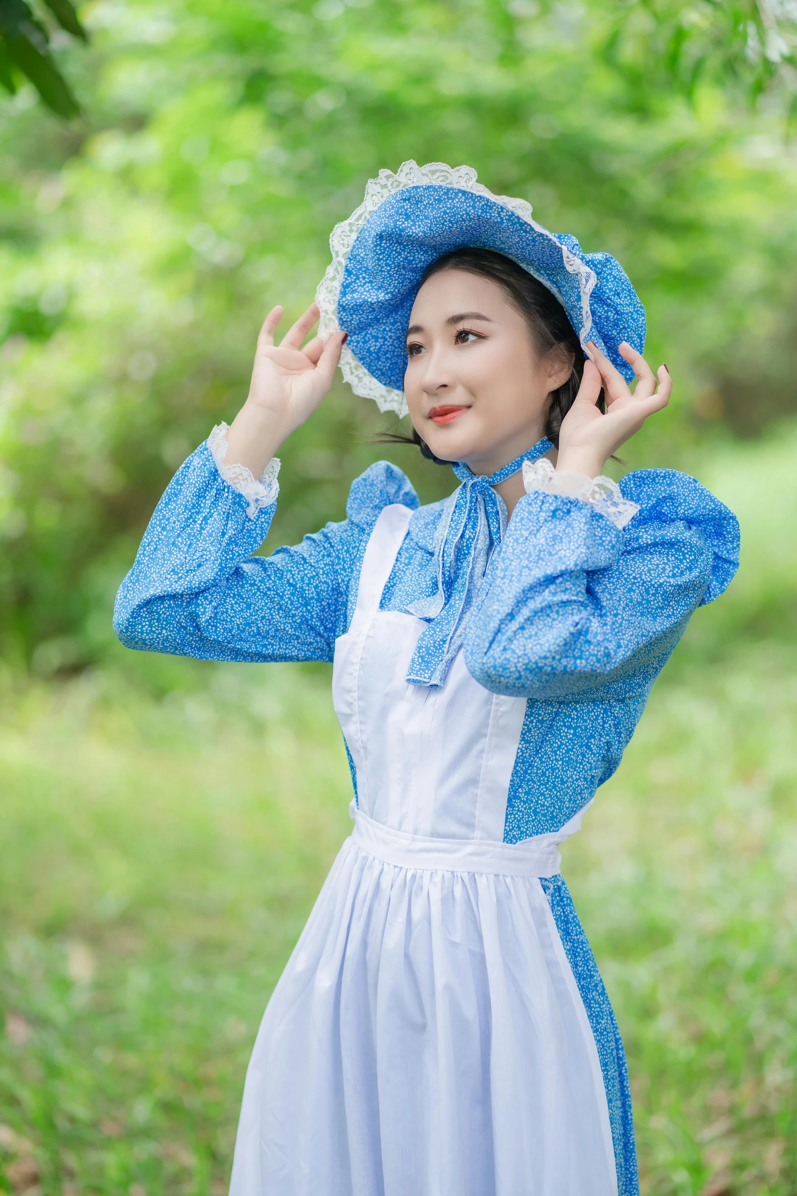 woman dressed in old fashioned clothes holding her hand on the side