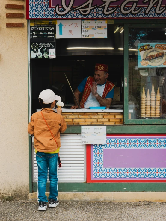 a  standing in front of a restaurant