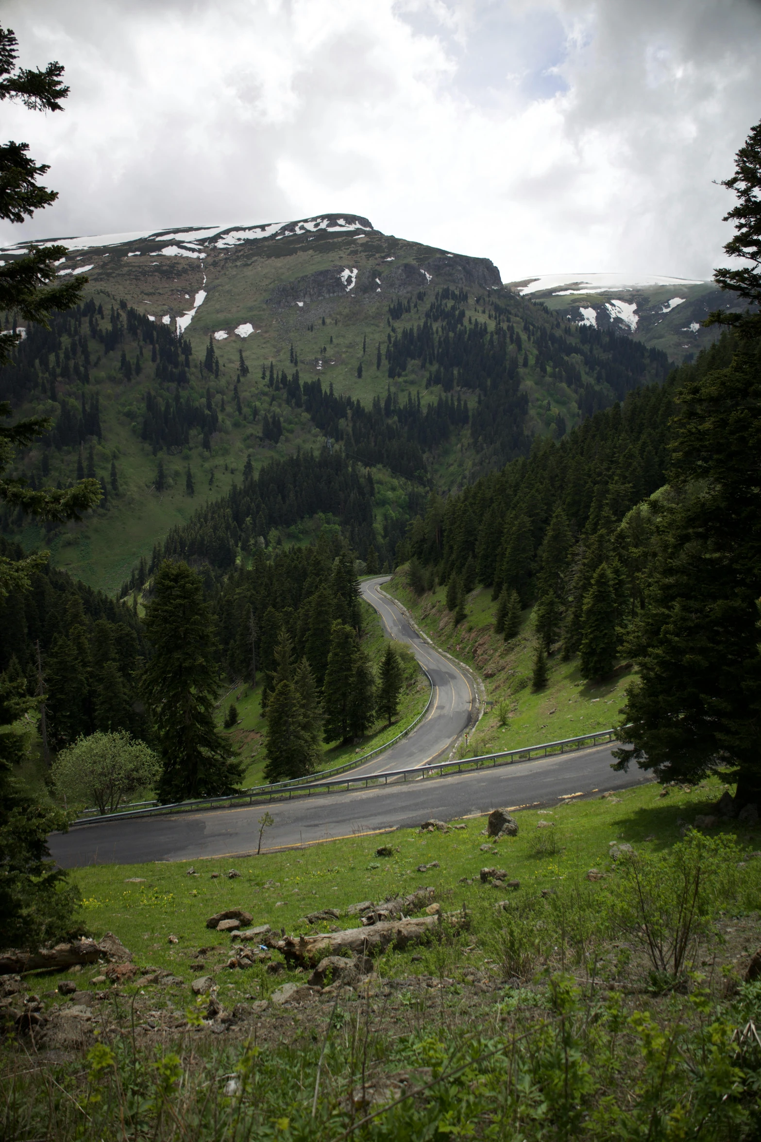 a street leading to a mountain pass in the mountains