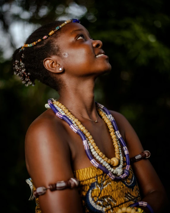 a woman with beads and a necklace