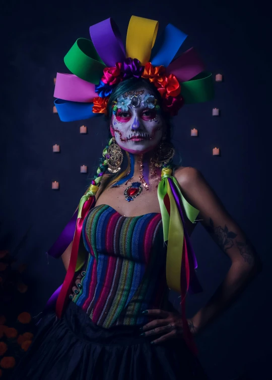 a woman in a costume with colored ribbons around her head