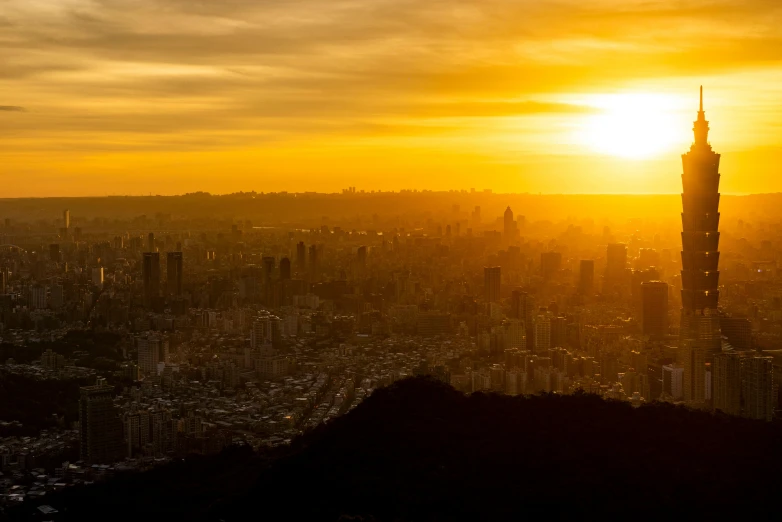 an aerial view of a city at sunset