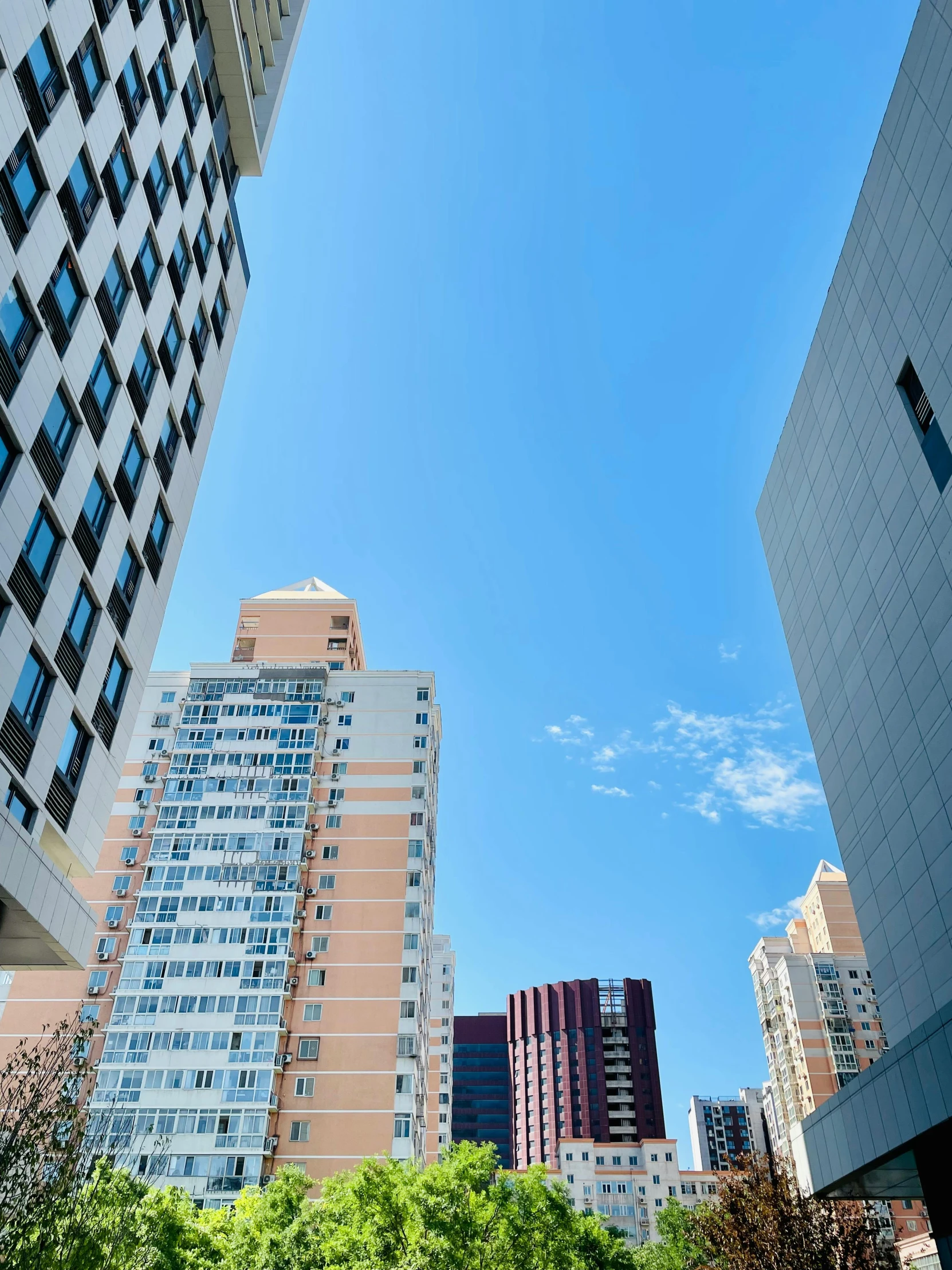 a view of two buildings next to each other from the street