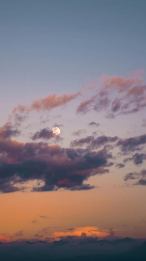 the clouds are white and pink in this sky