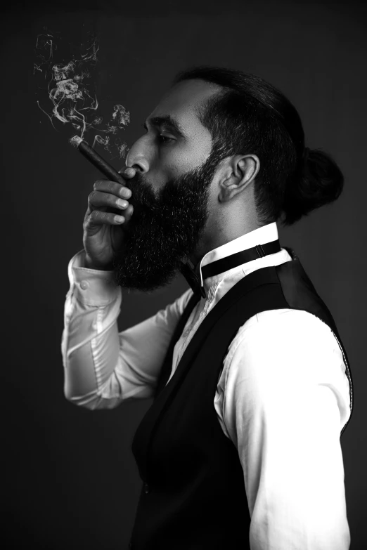 a man with a beard smoking a pipe