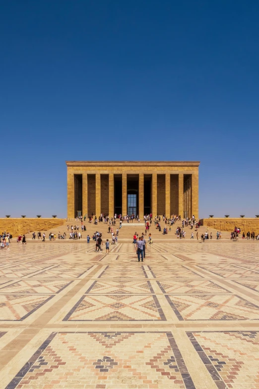 people are in the foreground of an empty temple