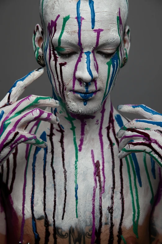 a man that has some paint on his body
