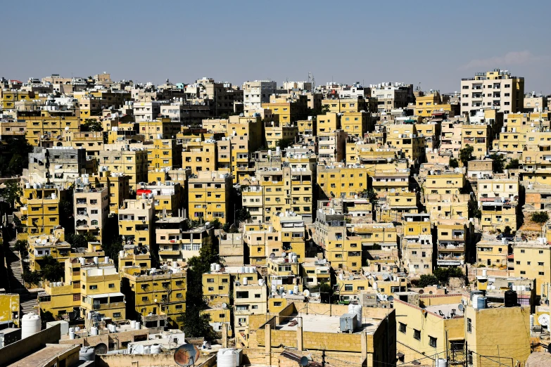 the brown and white buildings are all very tall