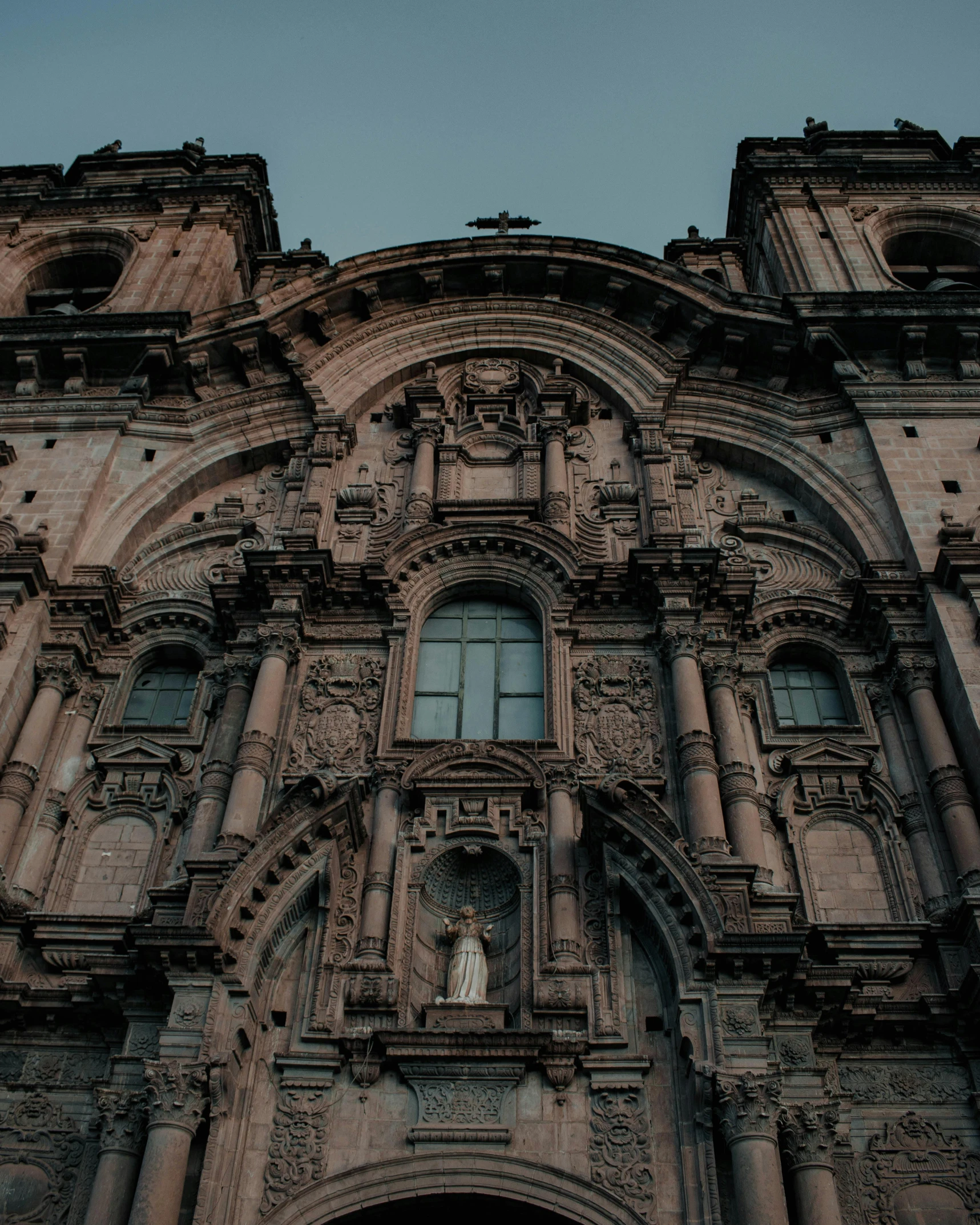 a old cathedral building with a clock at the top of it