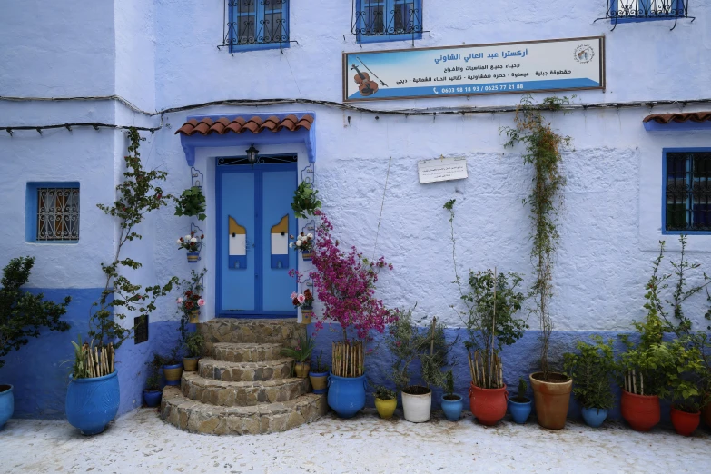 a blue front door and steps of a house