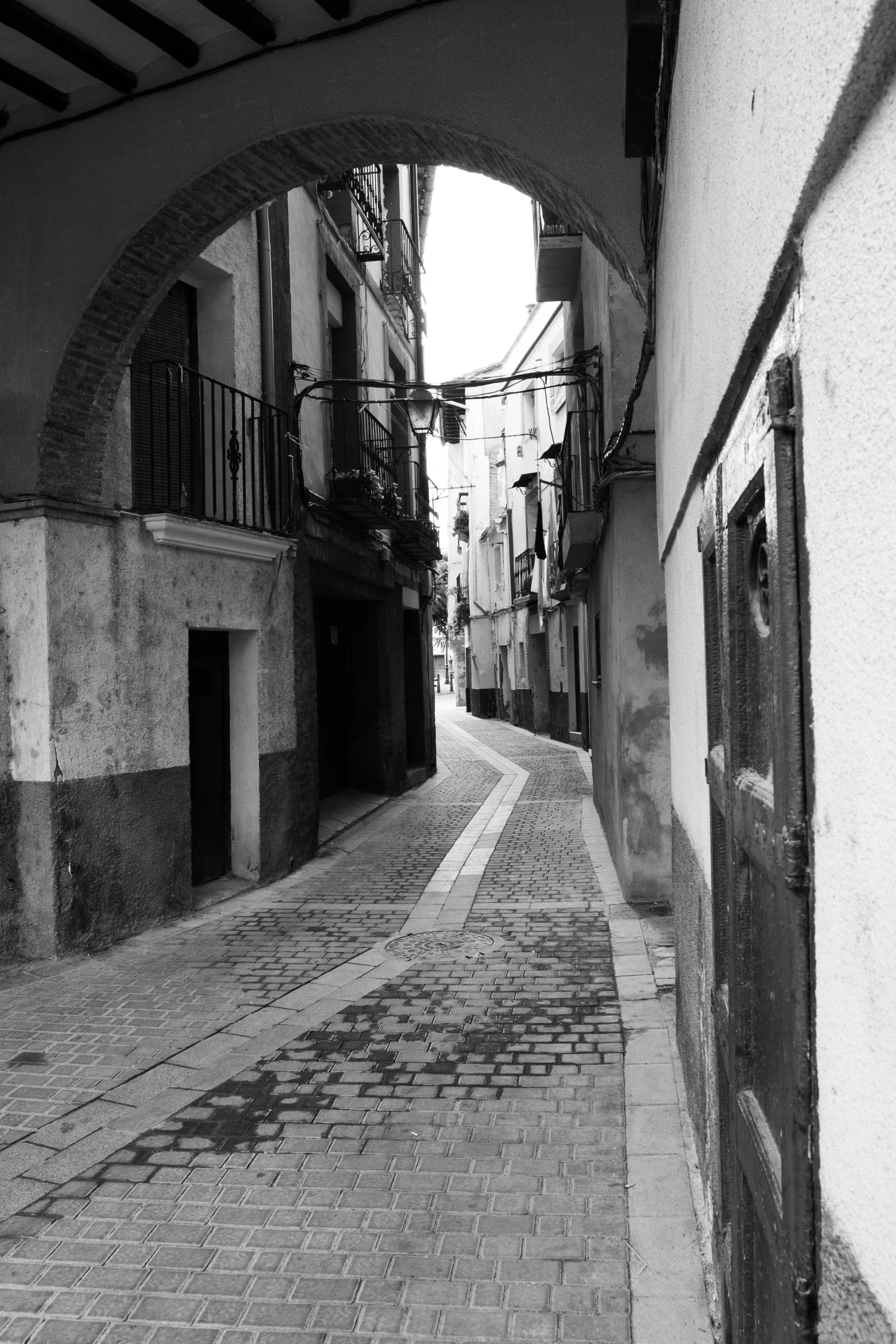 a po taken of an alley that has old buildings