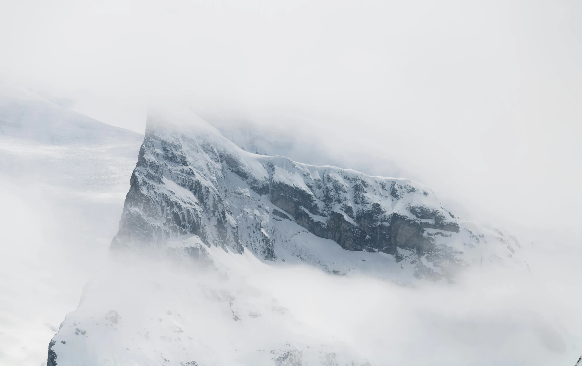 the mountain is covered with thick snow in the storm