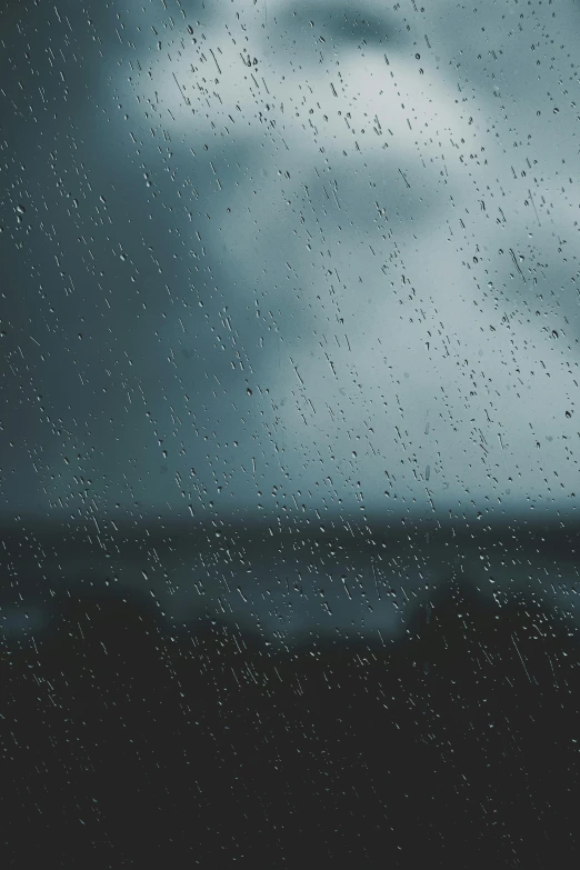 drops of rain on a window, on a rainy day