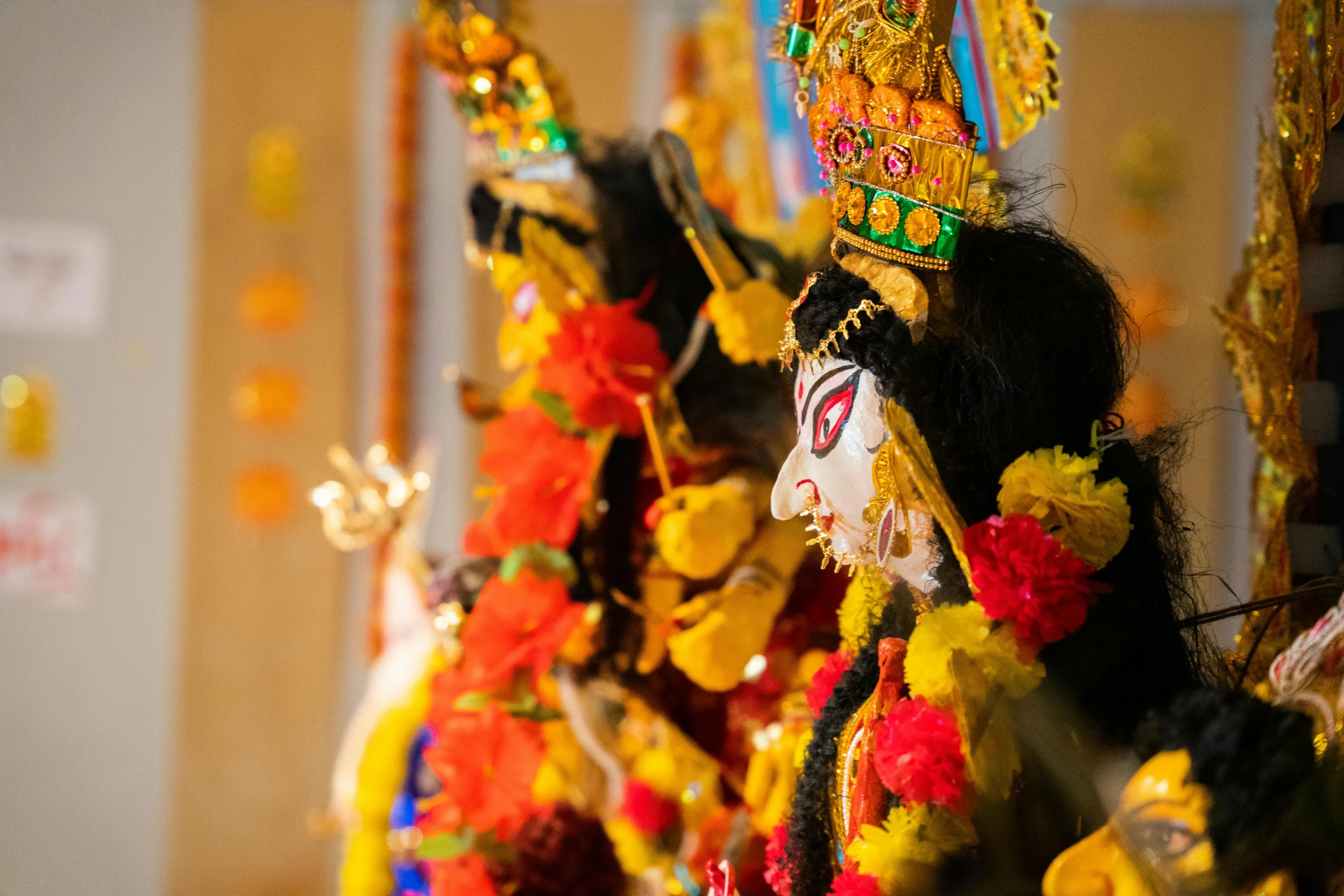 a row of colorful costumes on display in front of a wall