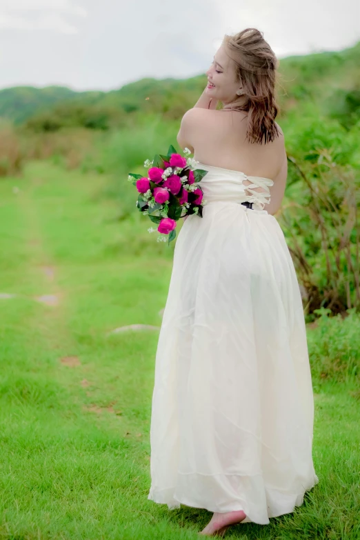 a young woman with long hair in a white dress