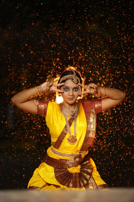 a person with makeup and body art standing in the rain