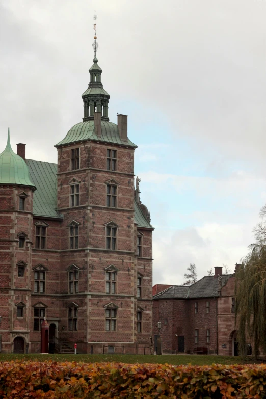 there is a tall, brick building with a turret shaped dome