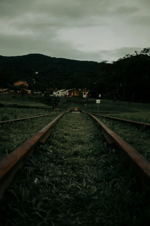 a view from behind an abandoned train tracks