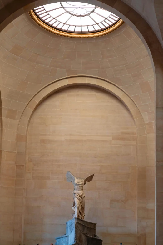 an interior area with a statue in the center