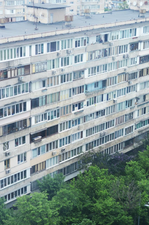 an aerial view of the outside of a large multi - unit building