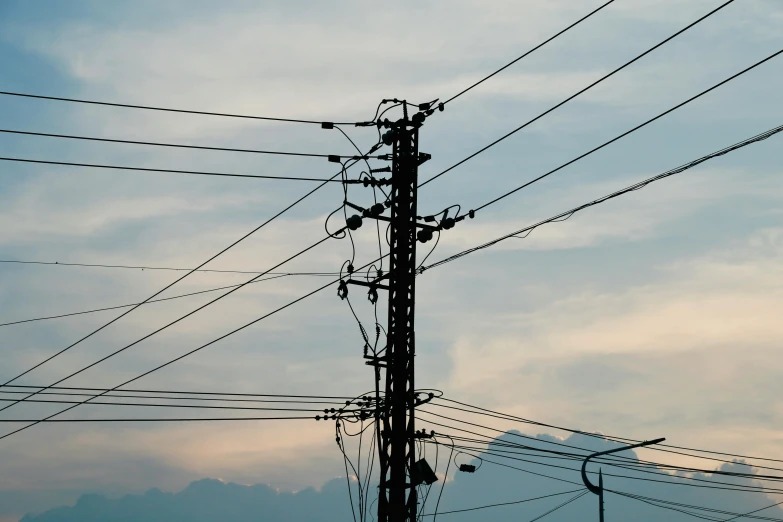 wires and cables are shown against the evening sky