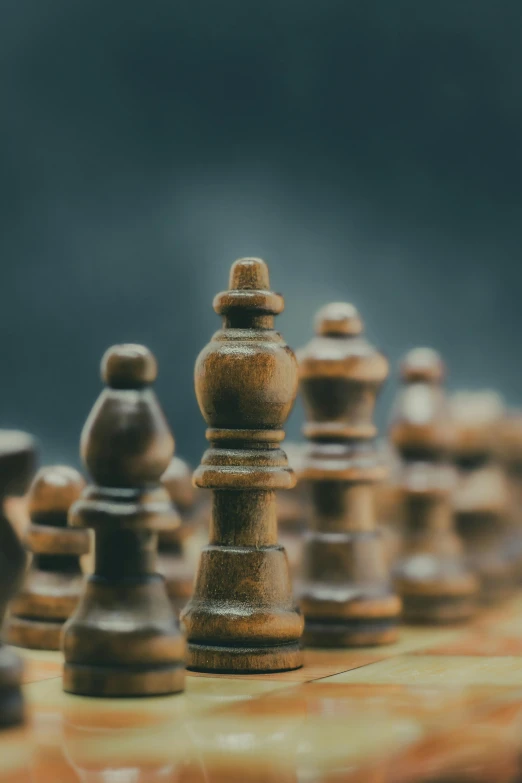 an old chess set is shown with a lot of chess pieces on it