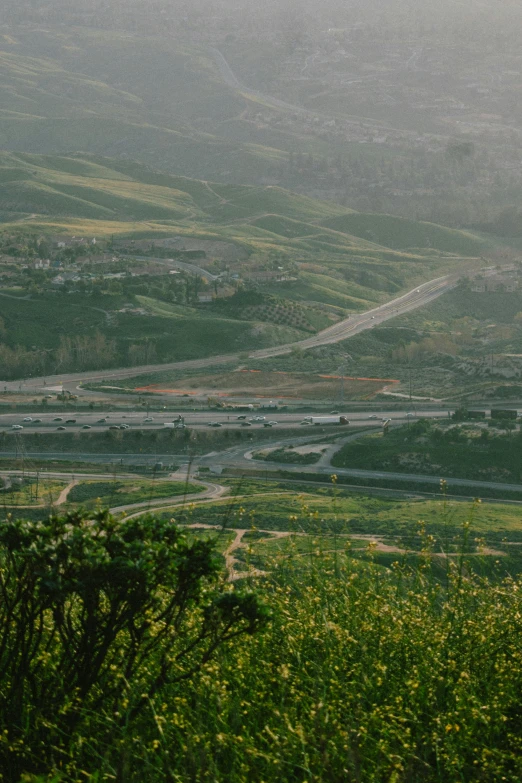 a city from top of a mountain in the rain