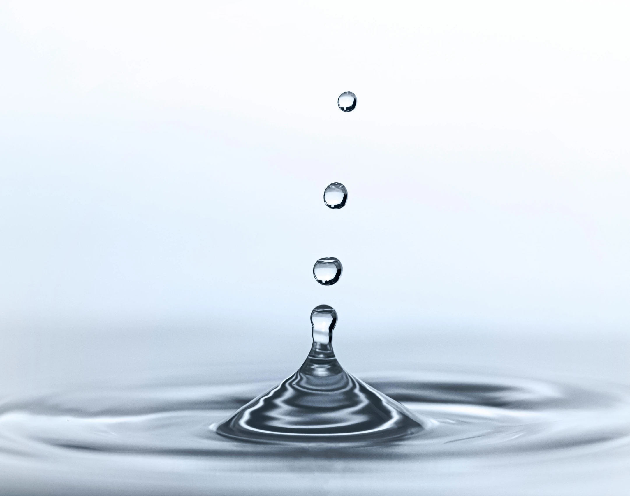 water droplets drop from a very large bowl