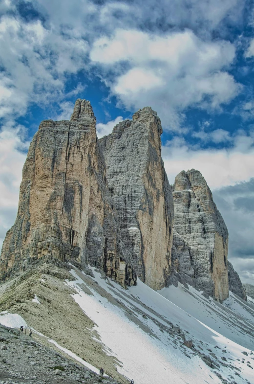 rocks are shown under a cloudy sky with clouds