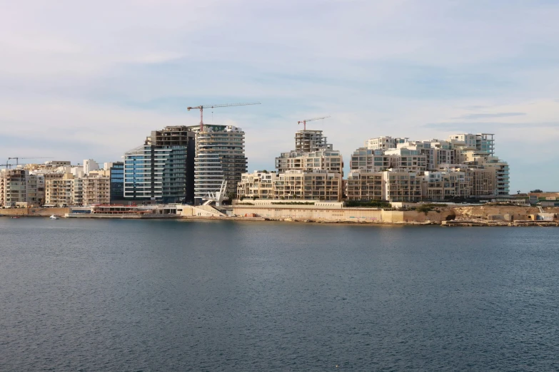 a skyline with a bunch of buildings that are by some water