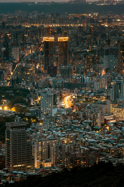 an urban area at night with lots of tall buildings