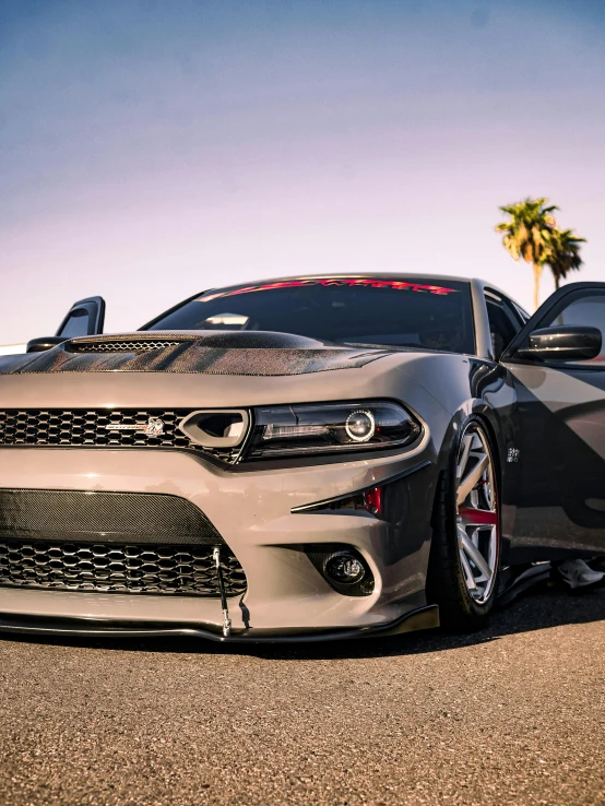 the front end of a car on a street