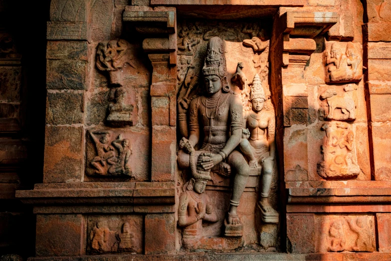 a statue is on display inside a temple