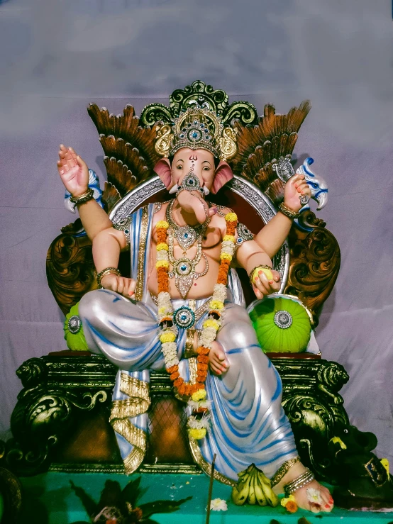 a statue of ganesh in a golden temple