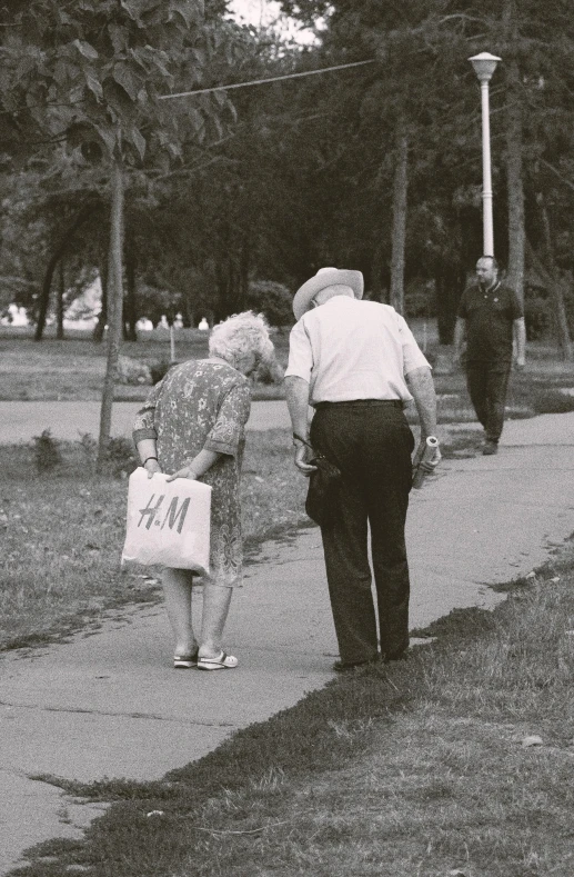 two people on the side walk looking at one another