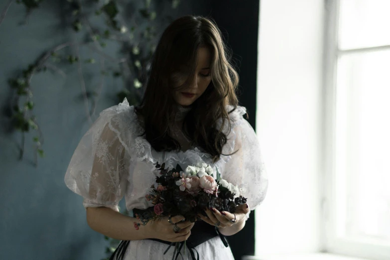 a woman wearing a dress standing with her hands on her waist