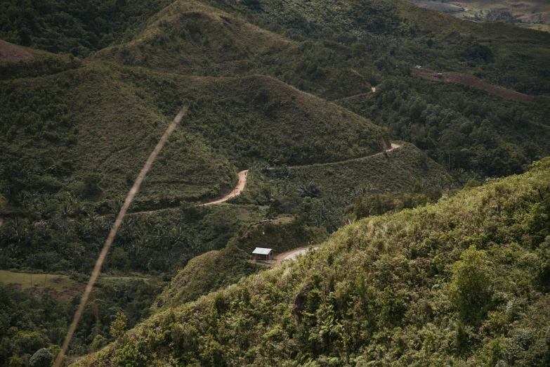 the roads are winding on both sides of a mountain