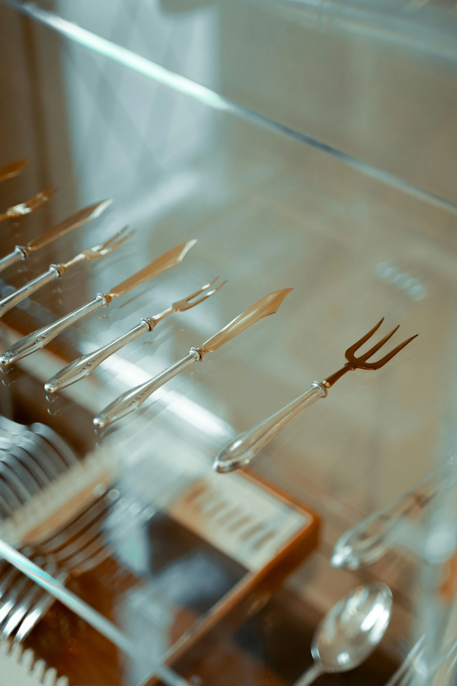 a metal fork sitting inside of a glass container