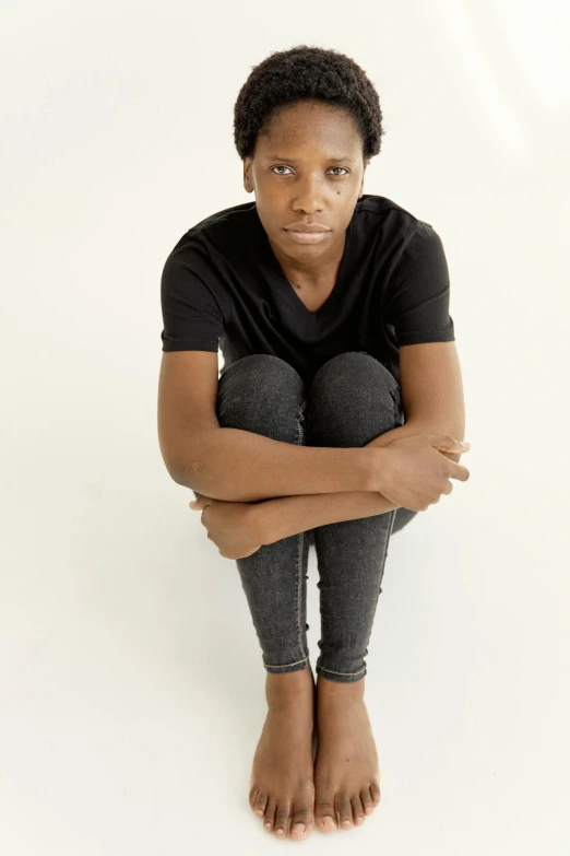 black young female in black shirt posing for picture