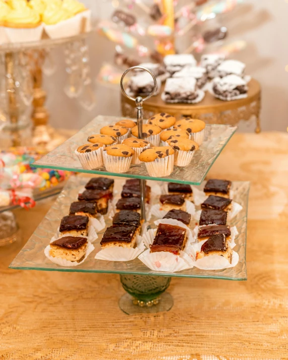 an assortment of cakes on a small platter