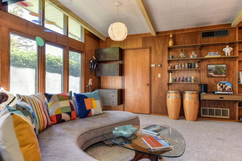 this is a picture of a living room with wood paneling